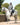 EQUIDRY waterproof horse riding raincoat All Rounder Original thick fleece Women's Charcoal/Pale Pink side view rider on horse