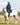 EQUIDRY waterproof horse riding raincoat All Rounder Original thick fleece Women's Navy/Pale Pink side view rider on horse