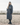EQUIDRY Charcoal Equimac long waterproof lightweight riding coat modelled by female horse riding instructor