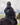 EQUIDRY women's long waterproof horse riding coat in black/olive modelled by rider out hacking horse