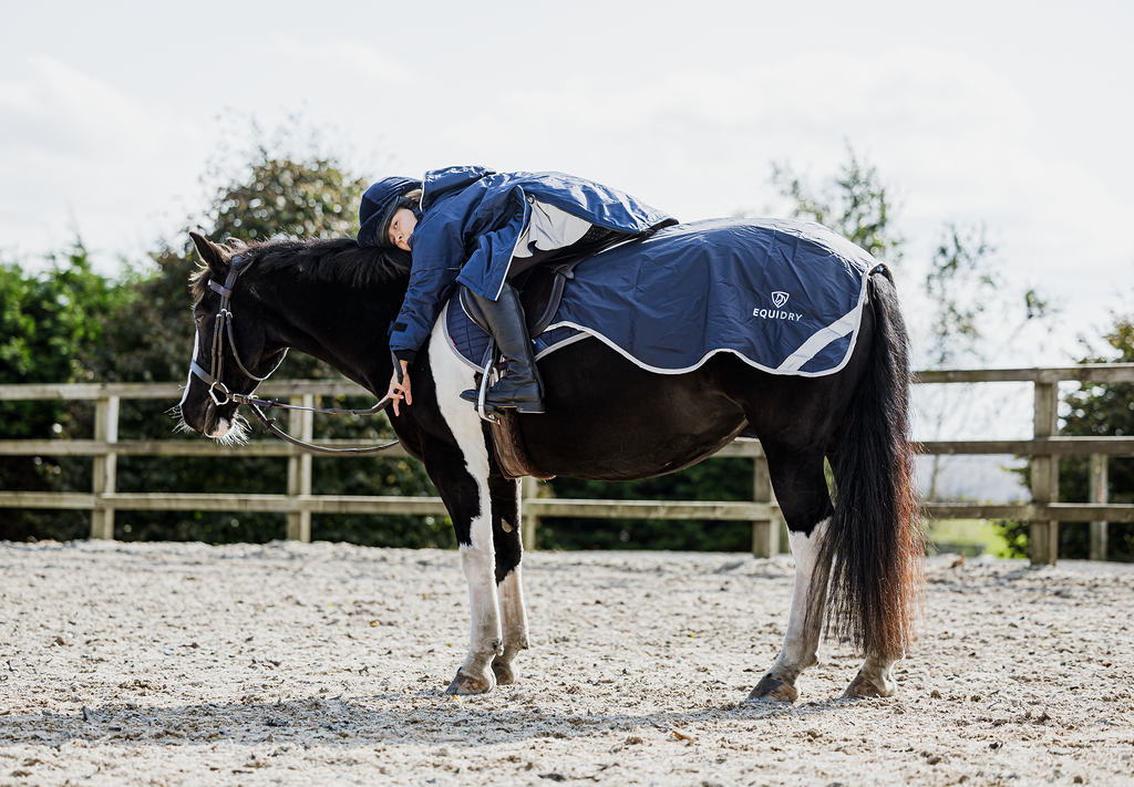 EQUIDRY waterproof horse riding raincoat thin fleece pro ride reflective in navy children's rider on horse with exercise sheet 