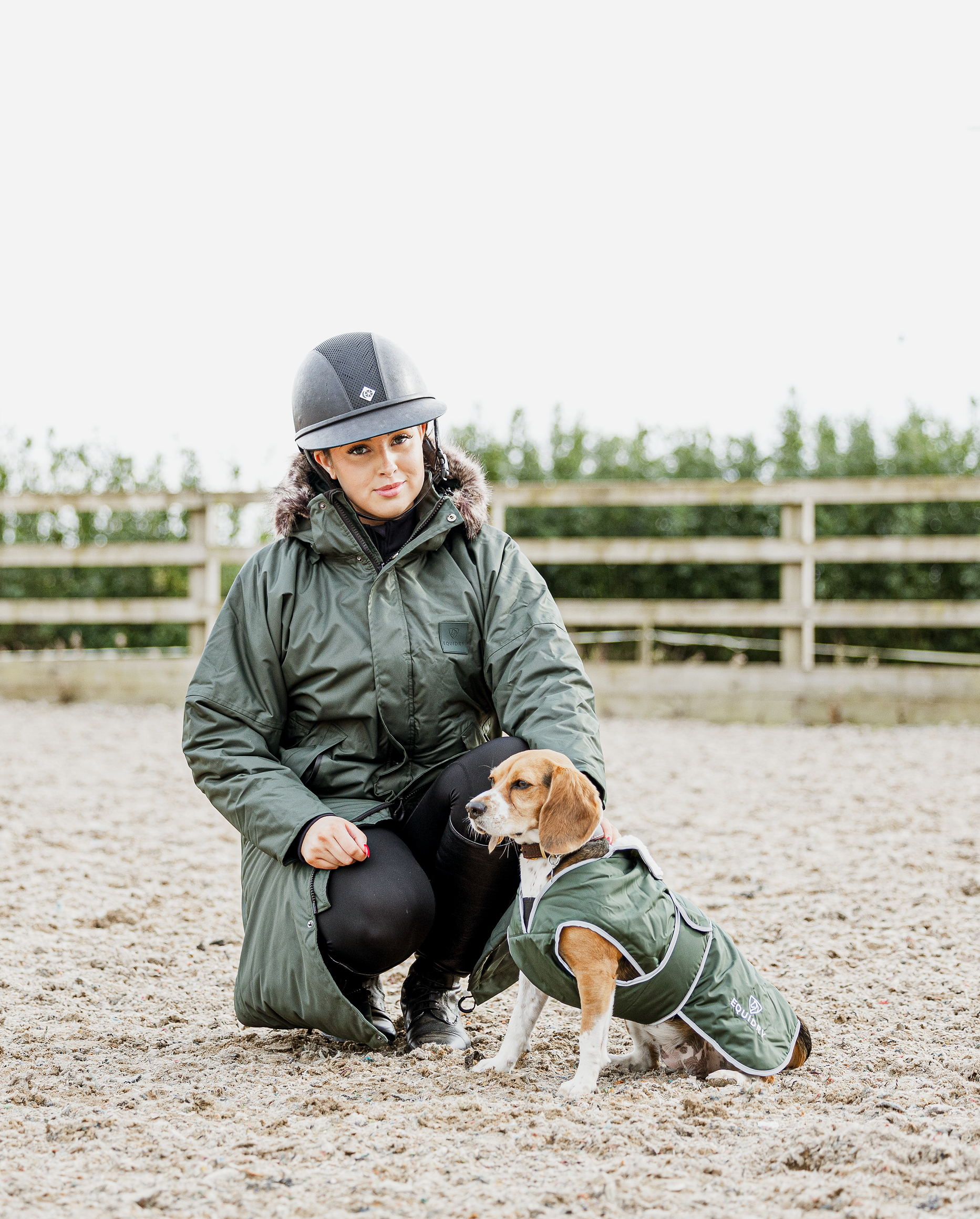 equidry women's black forest green waterproof riding and leisure coat with padded inner detachable faux fur trim rider with dog in matching dog coat