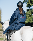 EQUIDRY Equestrian oversized waterproof Horse Riding Coat in Navy with Raspberry lining worn by Rider out hacking Pony