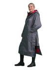 EQUIDRY women's long waterproof horse riding coat in Charcoal/Peacock Pink studio side showing side zips