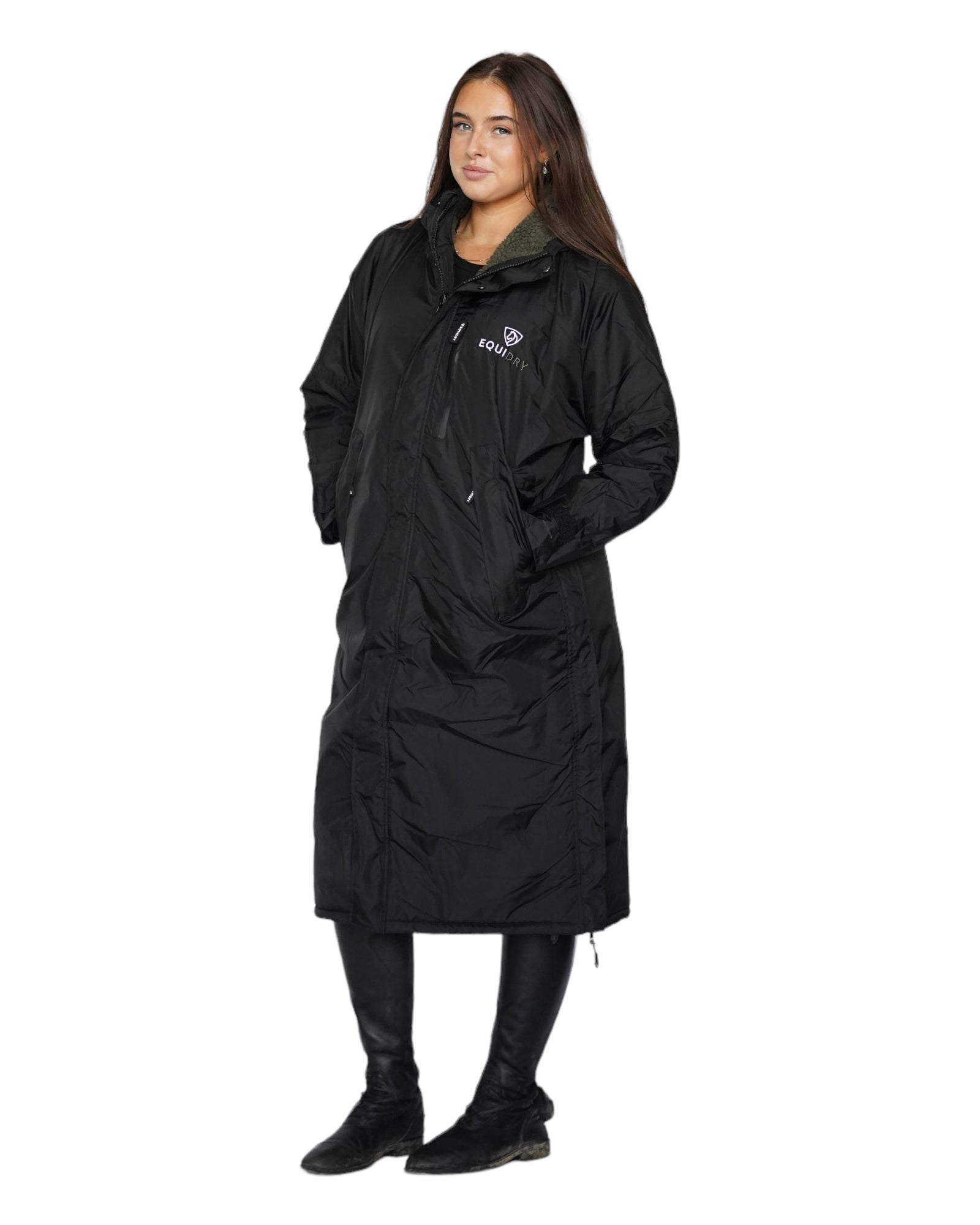 EQUIDRY women's long waterproof horse riding coat in Black/Olive Green front view full length modelled by rider 