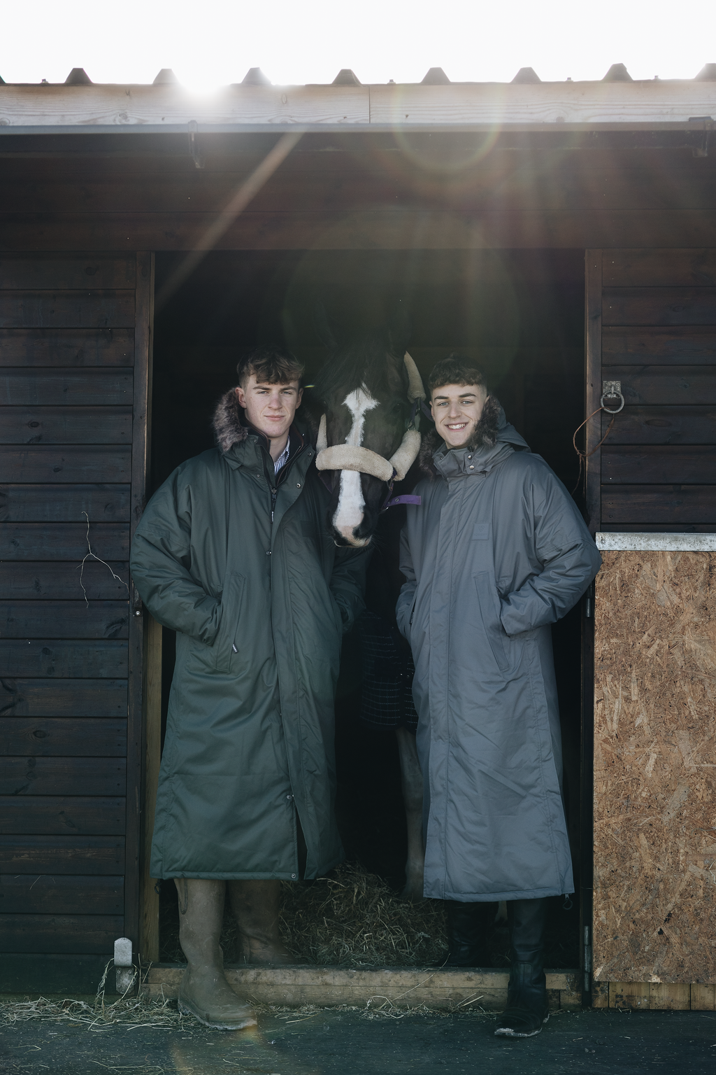 EQUIDRY | Parka | Men's | Charcoal - waterproof riding and leisure coat with padded inner detachable faux fur trim riders stood with horse