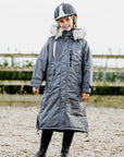 EQUIDRY Evolution Lux children's Warm Waterproof Winter Horse Riding Coat Thick Fleece Lining with Faux Fur Trim Hood being shown in charcoal/lilac 