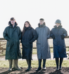 EQUIDRY Parka with fur hood modelled by young riders on farmland walk