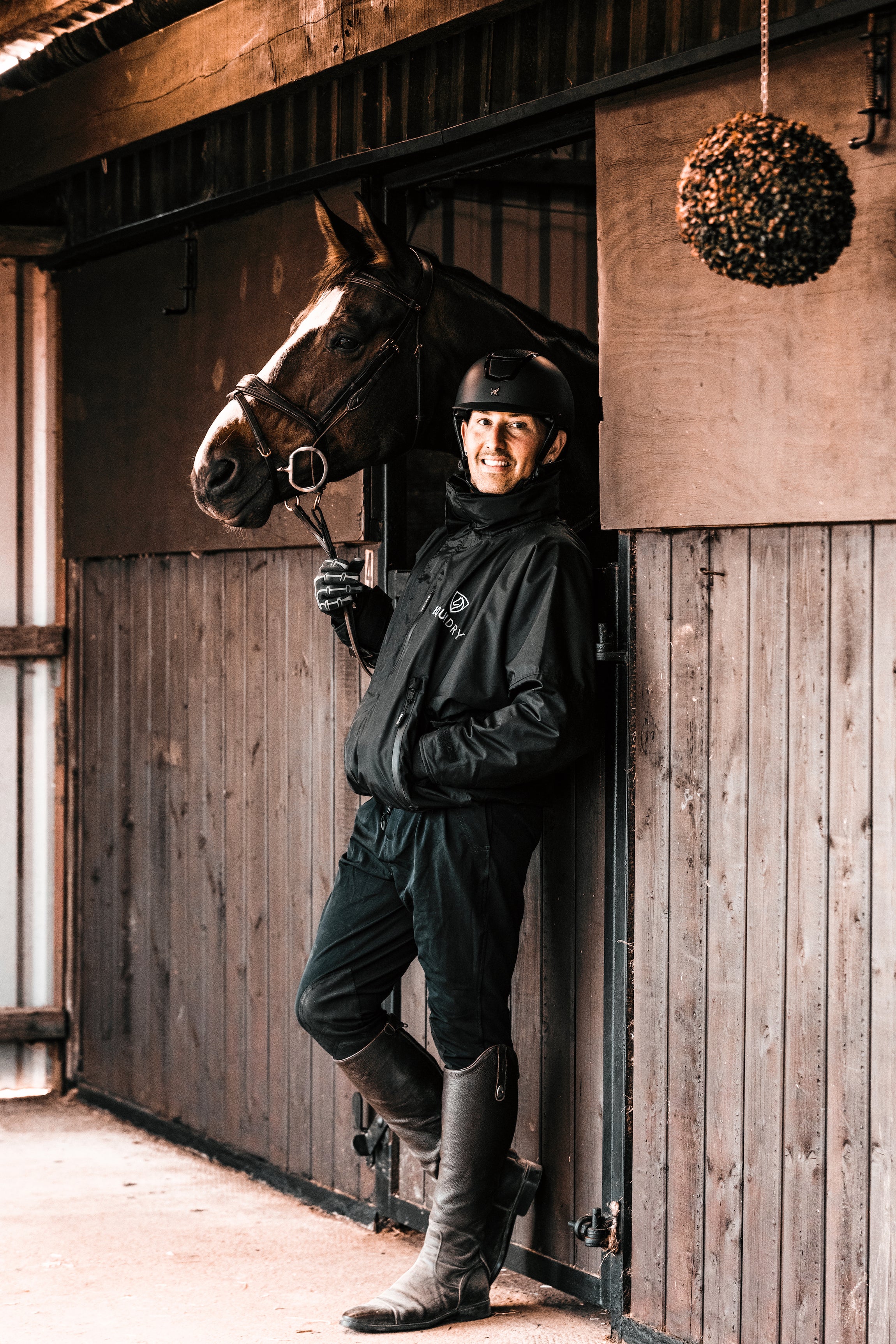 EQUIDRY men's waterproof short blouson style horse riding jacket in black with horse on yard