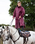 Evolution Reflective Men's Lightweight Waterproof Horse Riding Coat in plum worn by male stunt rider 