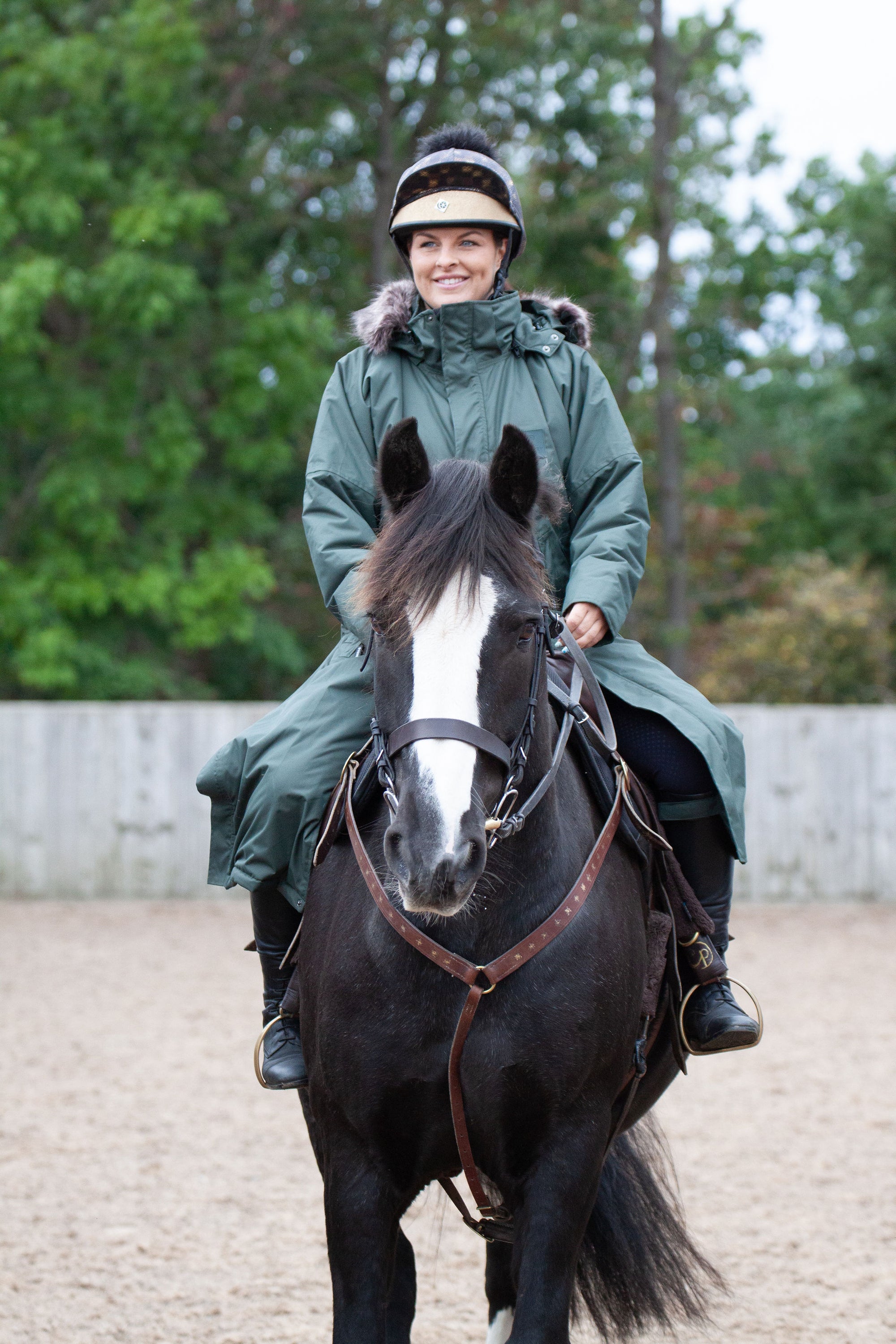 equidry parka black forest green waterproof riding and leisure coat with padded inner detachable faux fur trim stunt rider on horse 