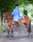 EQUIDRY women's thin fleece long waterproof horse riding coat in sky blue on horse 