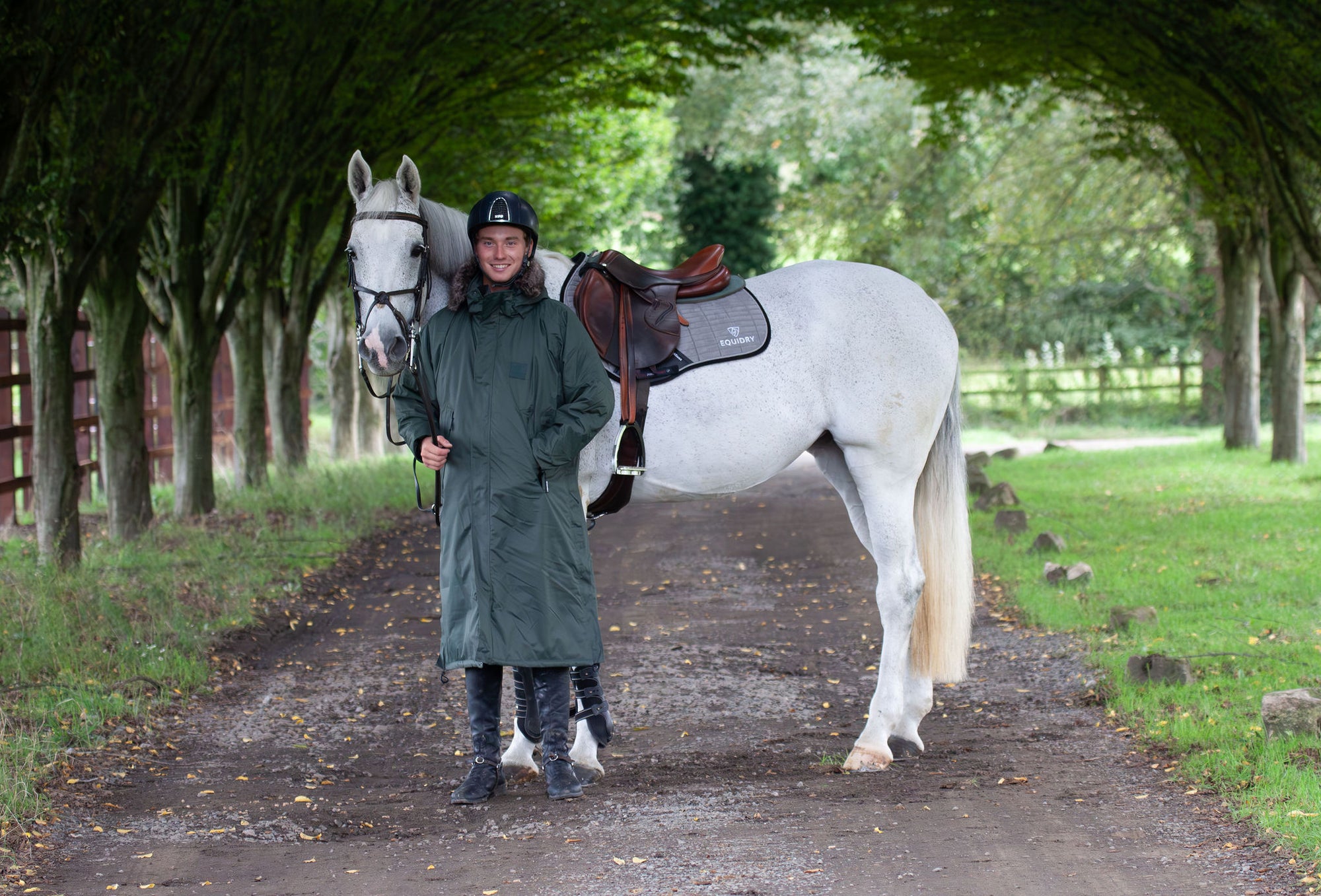 equidry black forest green waterproof riding and leisure coat with padded inner detachable faux fur trim rider with horse