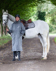 Evolution Equimac Men's Lightweight Waterproof Horse Riding Raincoat in charcoal modelled by male rider with horse