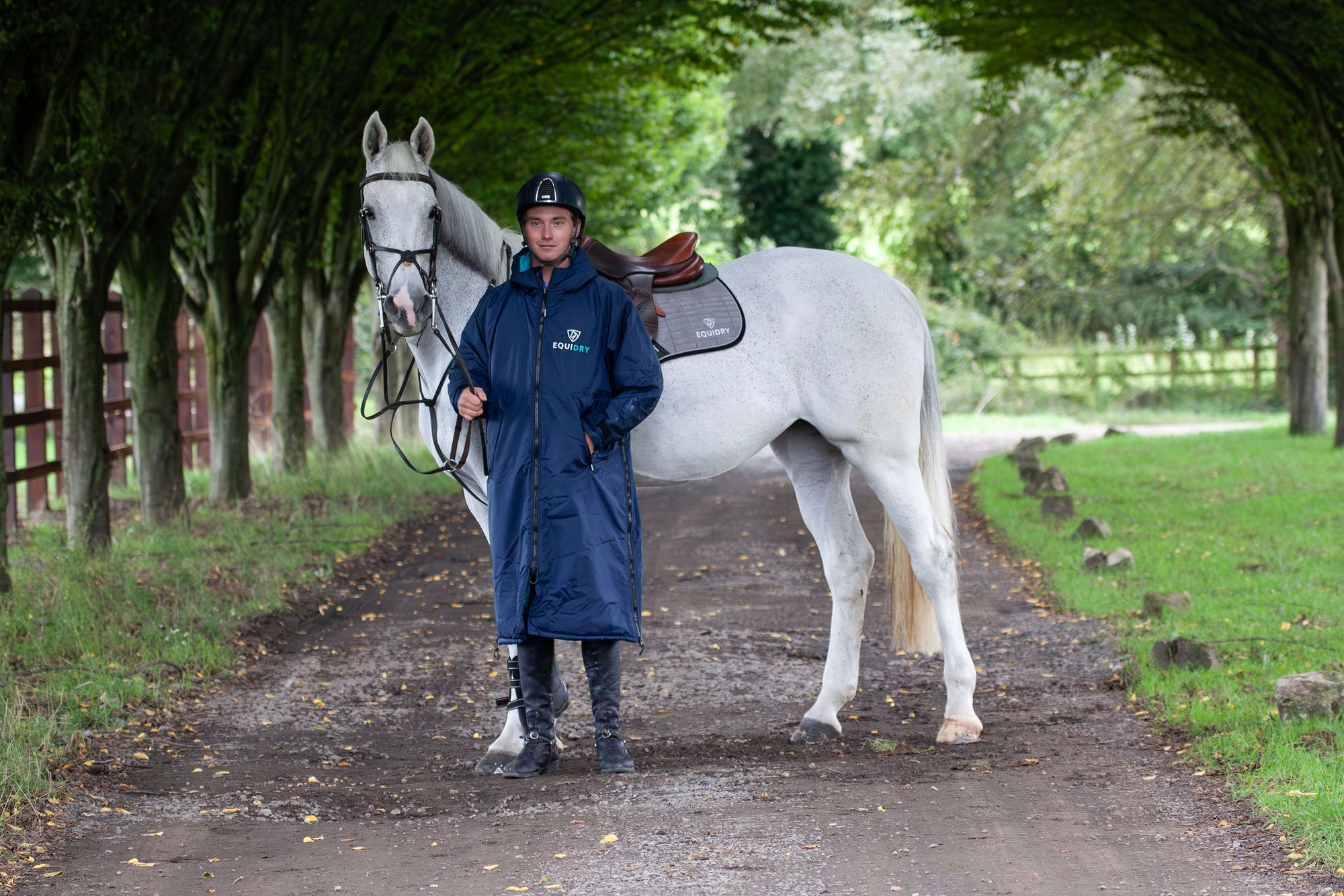 Original All Rounder Men's Oversized Waterproof Equestrian Coat navy/turquoise rider stood with horse